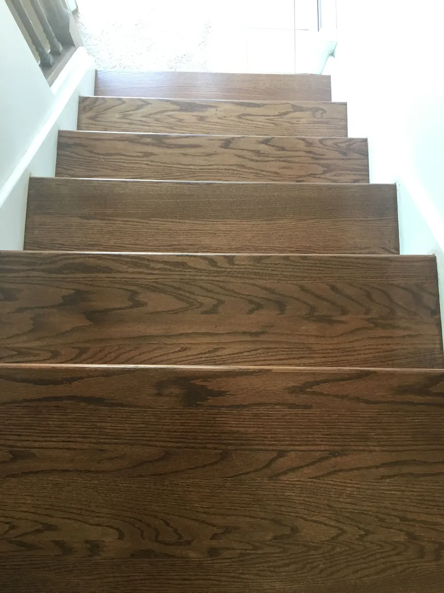Oak stair treads finished in a deep brown stain