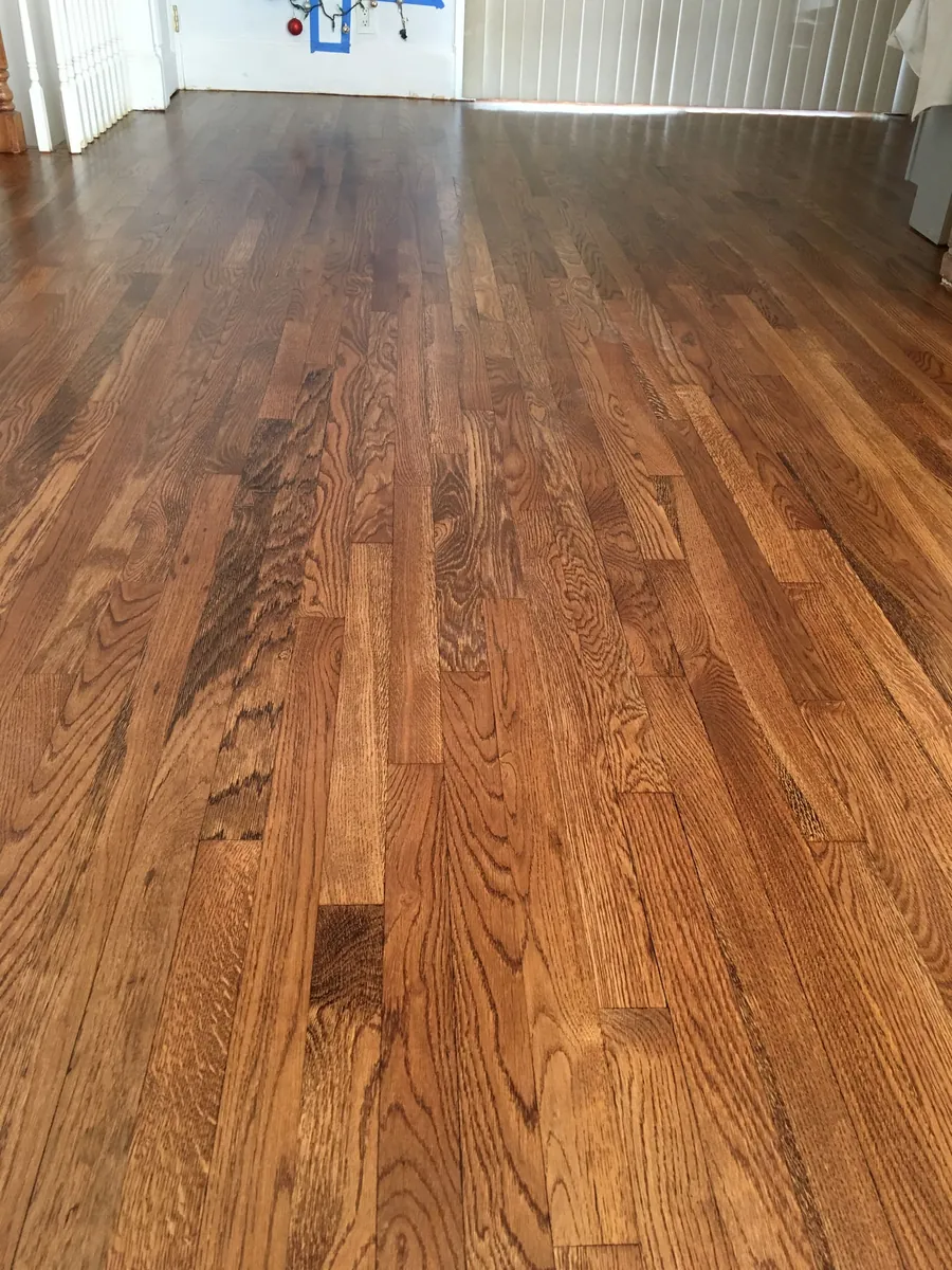Freshly finished oak floor with strong grain and a warm honey tone
